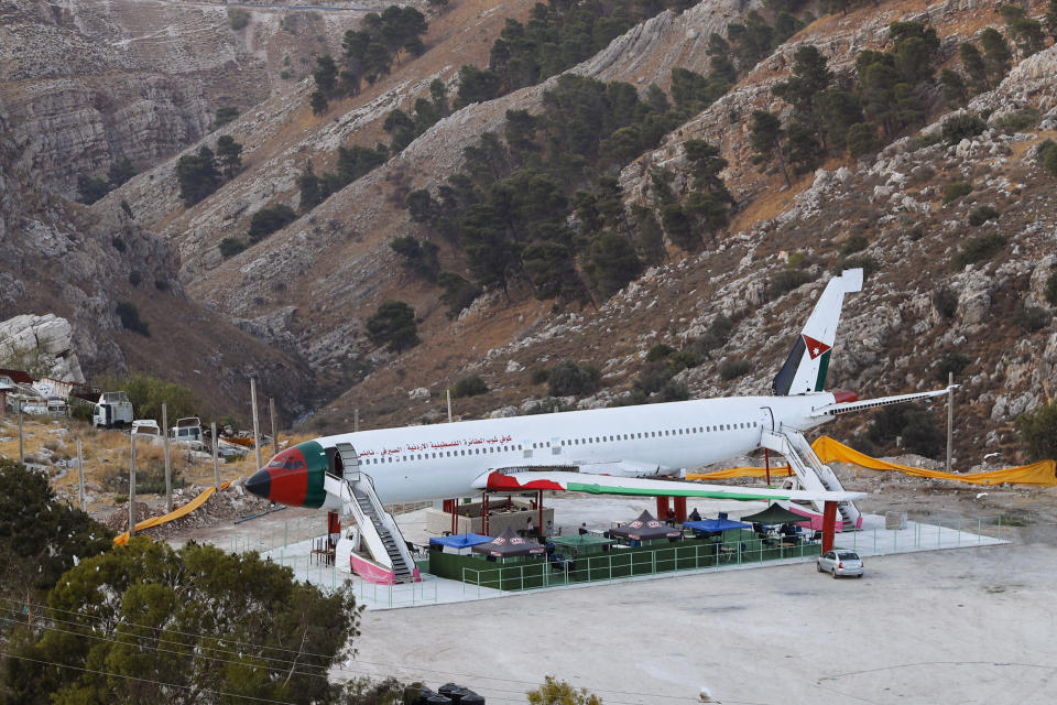 FILE - A Boeing 707 aircraft has been converted to a cafe, in Wadi Al-Badhan, just outside the West Bank city of Nablus, Aug. 11, 2021. The Israel Airports Authority said Tuesday, Aug. 9, 2022, that Israel will soon allow Palestinians from the occupied West Bank to travel on flights to Turkey out of an Israeli airport. (AP Photo/Majdi Mohammed, File)