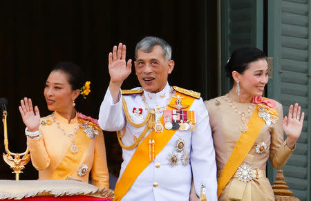 Thailand's newly crowned King Maha Vajiralongkorn, Queen Suthida and Princess Bajrakitiyabha are seen at the balcony of Suddhaisavarya Prasad Hall at the Grand Palace where King grants a public audience to receive the good wishes of the people in Bangkok, Thailand May 6, 2019.REUTERS/Jorge Silva