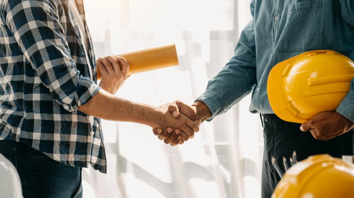 Shaking hands over a construction contractor's business.