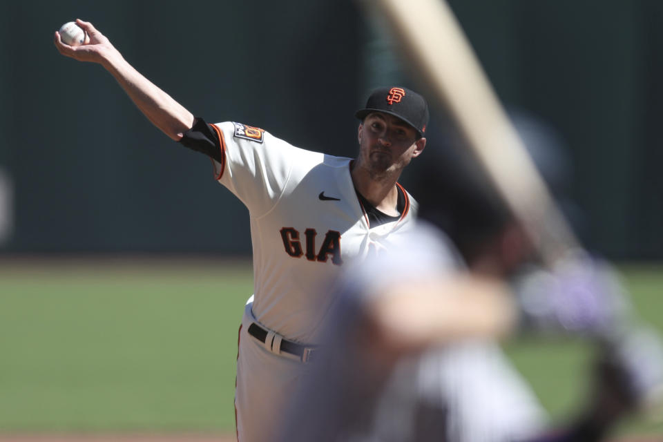 San Francisco Giants' Kevin Gausman throws against the Colorado Rockies during the second inning of a baseball game in San Francisco, Thursday, Sept. 24, 2020. (AP Photo/Jed Jacobsohn)