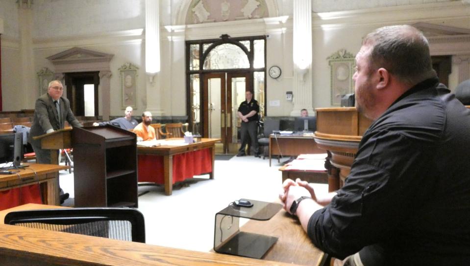 Detective Tyler Winkelman of the Crawford County Sheriff's Office, right, testifies during a bond-setting hearing for Jacob Dan Davidson of Centerburg in Crawford County Common Pleas Court on Monday.