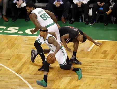 Apr 16, 2017; Boston, MA, USA; Boston Celtics forward Amir Johnson (90) sets a pick on Chicago Bulls guard Rajon Rondo (9) as Boston Celtics guard Isaiah Thomas (4) takes the ball around him during the first quarter in game one of the first round of the 2017 NBA Playoffs at TD Garden. Mandatory Credit: Winslow Townson-USA TODAY Sports