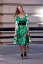 <p>More than three years after we left Carrie Bradshaw in Paris, Sarah Jessica Parker stepped back into her Manolo Blahniks to reprise her famous role. The film's opening outfit—a now-iconic contrasting mix of a green printed dress and jacket, topped off with a black spiked belt—did Bradshaw's unique style justice. </p>