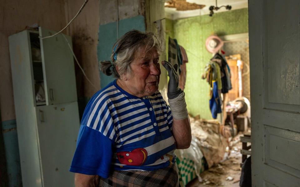 Kateryna Kostiantynivna walks through her shattered home while recalling first week of the Russian invasion - John Moore/Getty Images