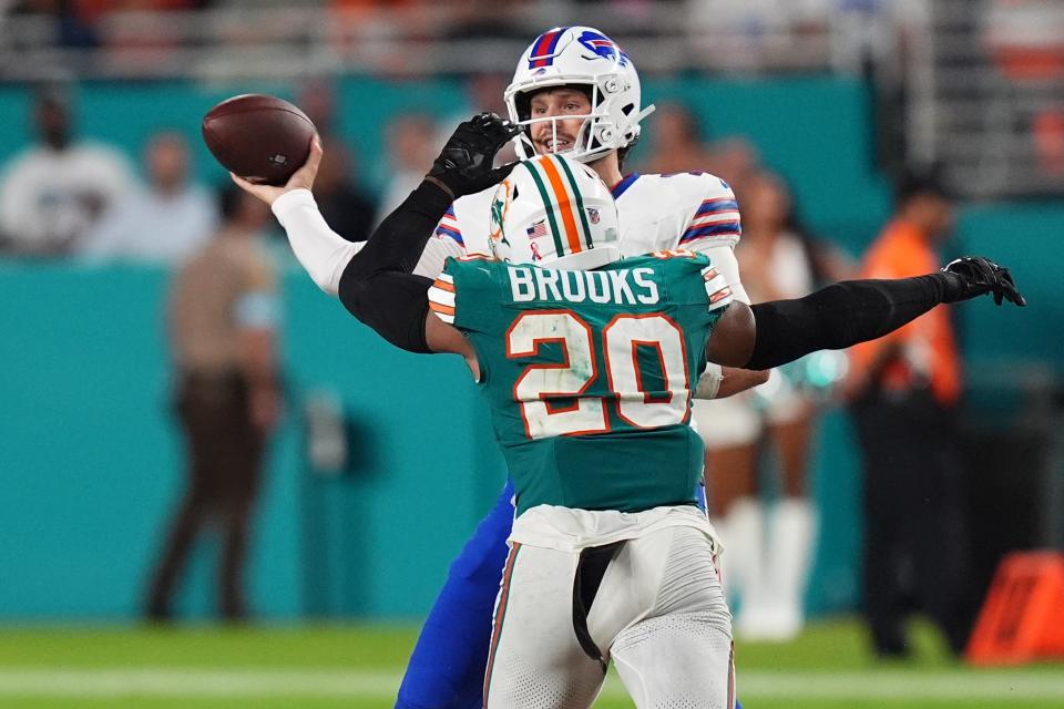 Sep 12, 2024; Miami Gardens, Florida, USA; Miami Dolphins linebacker Jordyn Brooks (20) pressures Buffalo Bills quarterback Josh Allen (17) the second half at Hard Rock Stadium. Mandatory Credit: Jasen Vinlove-Imagn Images