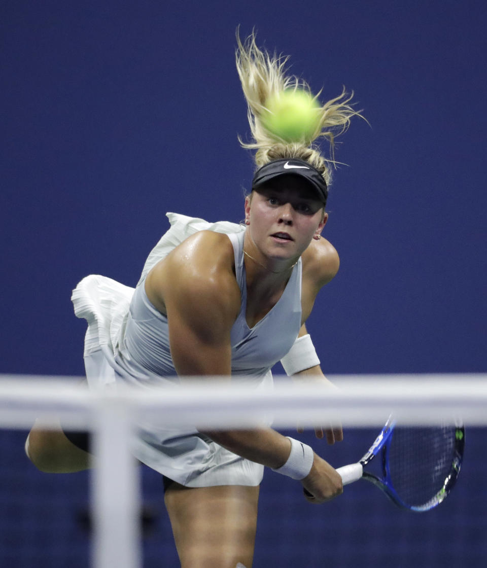 Carina Witthoeft, of Germany, watches her serve against Serena Williams during the second round of the U.S. Open tennis tournament, Wednesday, Aug. 29, 2018, in New York. (AP Photo/Julio Cortez)