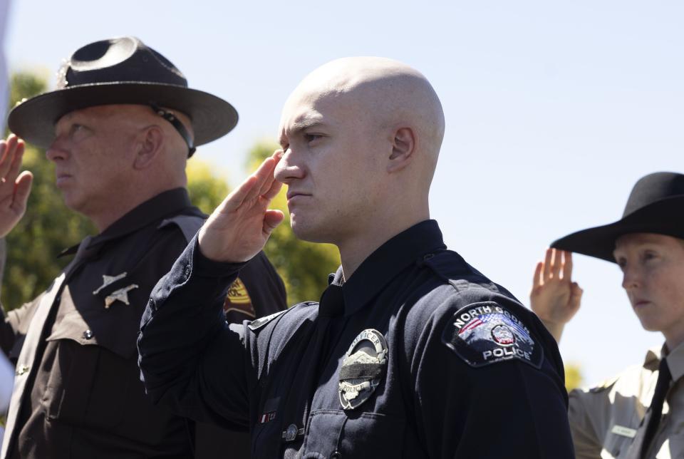 Law enforcement officers pay their respects at the memorial service for Cpl. Steven Lewis and deputy Jennifer Turner at the Dee Events Center in Ogden on Friday, July 14, 2023. Lewis and Turner were killed in a wrong-way crash near the intersection of South Weber Drive and Canyon Meadows Drive on Monday, July 3. | Laura Seitz, Deseret News