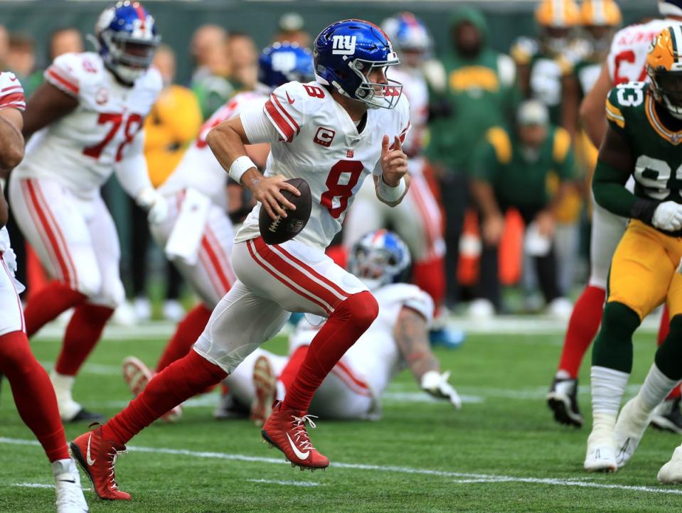 Daniel Jones carries the ball against the Green Bay Packers (PA)