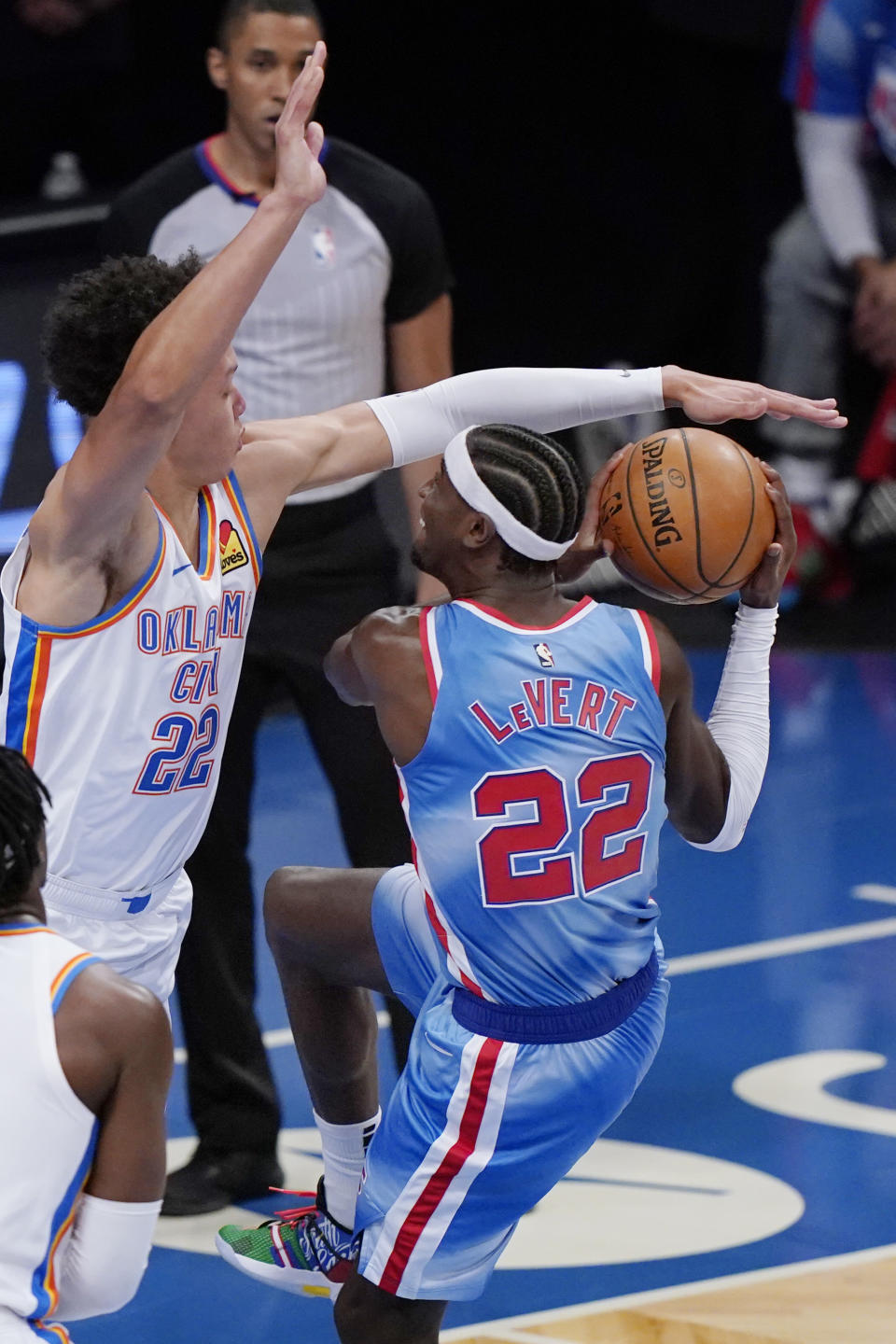 Oklahoma City Thunder forward Isaiah Roby (22) tries to block Brooklyn Nets guard Caris LeVert (22) as LeVert prepares to go for a layup during the first quarter of an NBA basketball game Sunday, Jan. 10, 2021, in New York. (AP Photo/Kathy Willens)