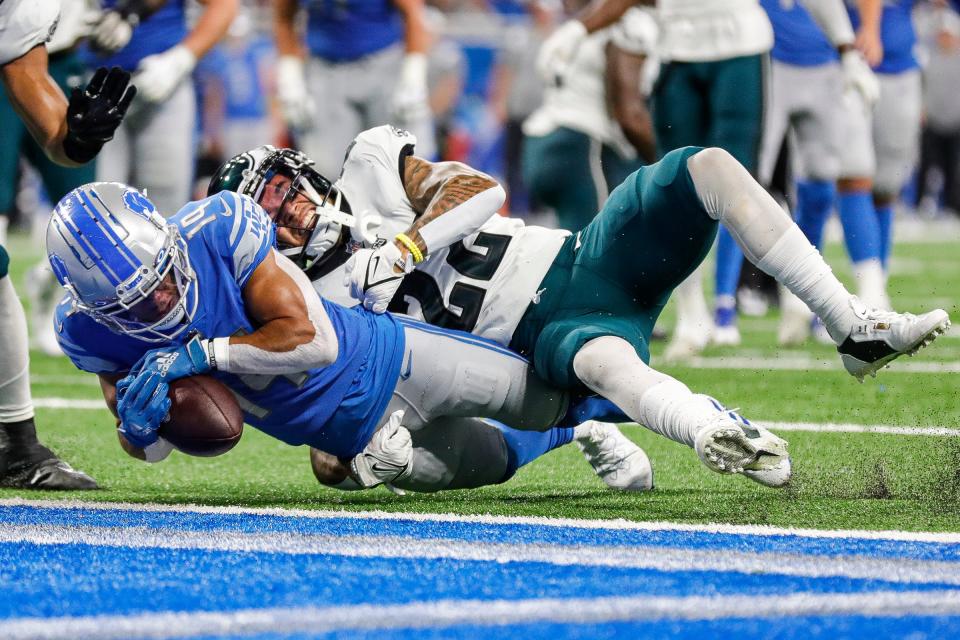 Detroit Lions wide receiver Amon-Ra St. Brown makes a catch against Philadelphia Eagles safety Marcus Epps during the second half at Ford Field, Sept. 11, 2022.