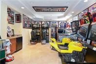 <p>It won’t be hard to entertain guests with this awesome arcade room. (Realtor.com) </p>