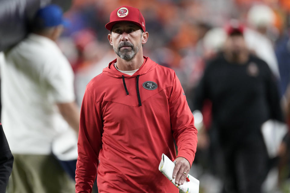 San Francisco 49ers head coach Kyle Shanahan walks off the field after an NFL football game against the Denver Broncos in Denver, Sunday, Sept. 25, 2022. (AP Photo/David Zalubowski)