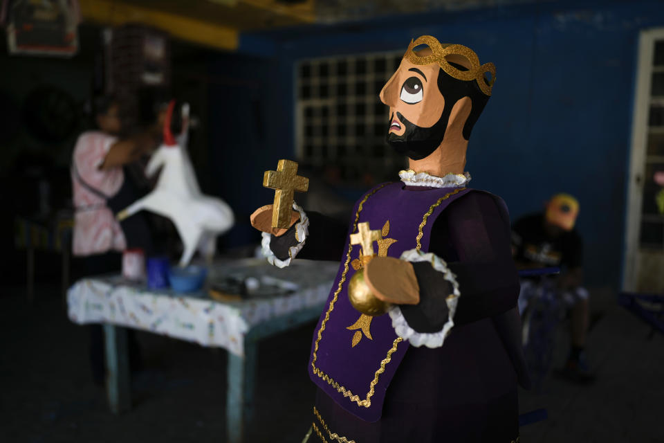 A paper-mache figure of Saint John of God stands in a fireworks workshop, made for the annual festival in honor of the Catholic saint, in Tultepec, Mexico, Wednesday, March 6, 2024. The celebration, now its 35th year, is to pay homage to the patron saint of the poor and sick, who the fireworks producers view as a protective figure. (AP Photo/Marco Ugarte)