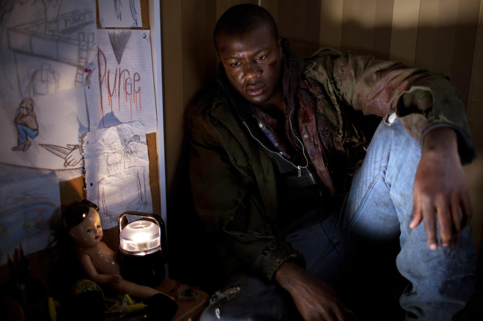 A man sitting in a closet