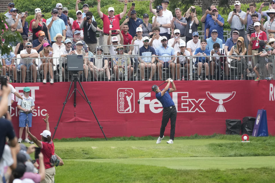 Rickie Fowler drives off the first tee during the third round of the Rocket Mortgage Classic golf tournament at Detroit Country Club, Saturday, July 1, 2023, in Detroit. (AP Photo/Carlos Osorio)