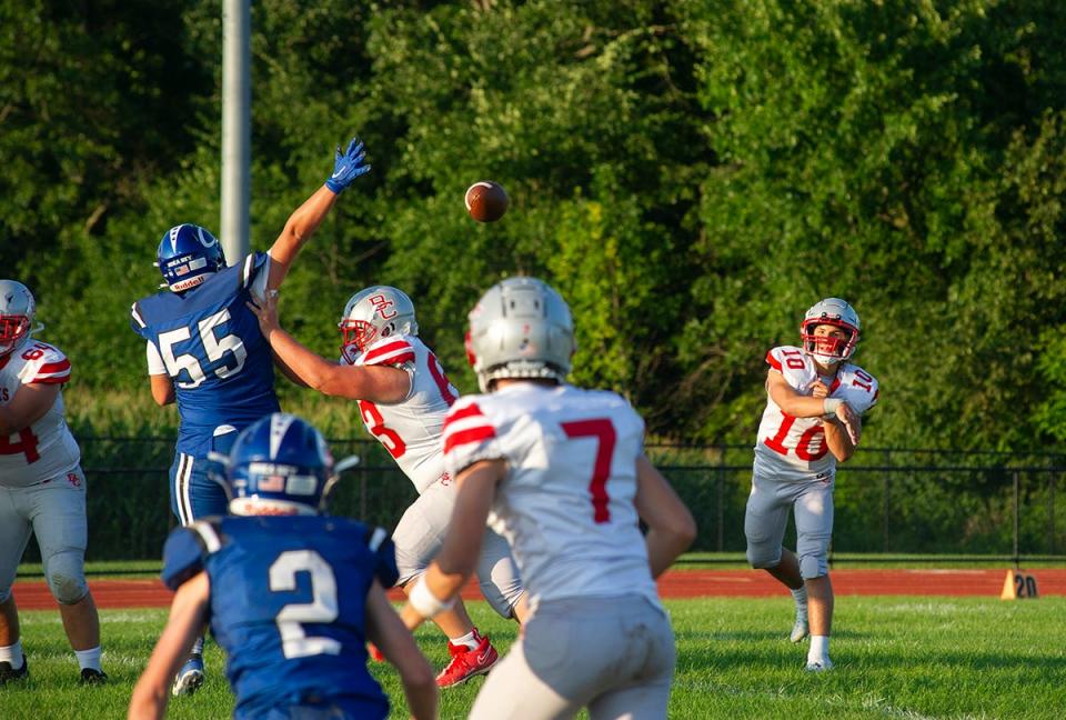 Buckeye Central's Derex Dean slings a pass out to a teammate.