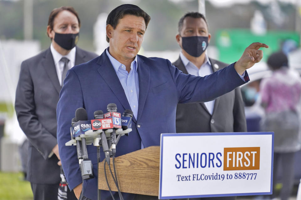 Florida Gov. Ron DeSantis gestures as he speaks to the media at a coronavirus vaccination site at Lakewood Ranch Wednesday, Feb. 17, 2021, in Bradenton, Fla. (Chris O'Meara/AP)