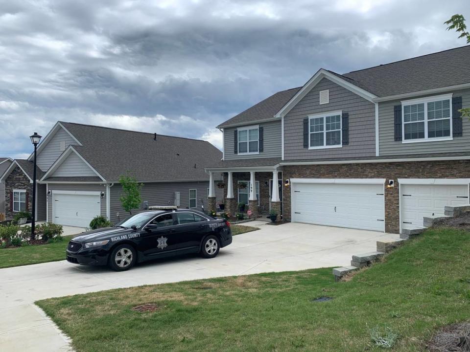 Police guard Jonathan Pentland’s house after he was charged with third-degree assault and battery in Columbia, SC when a viral video showed him yelling at and pushing a Black man in the Summit neighborhood.