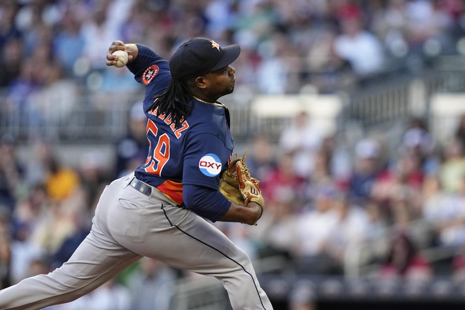 Houston Astros starting pitcher Framber Valdez (59) delivers in the first inning of a baseball game against the Atlanta Braves, Saturday, April 22, 2023, in Atlanta. (AP Photo/Brynn Anderson)