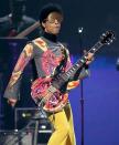 Prince performs with singer Mary J. Blige at the Iheart radio music festival in a psychedelic yellow ensemble. Groovy.