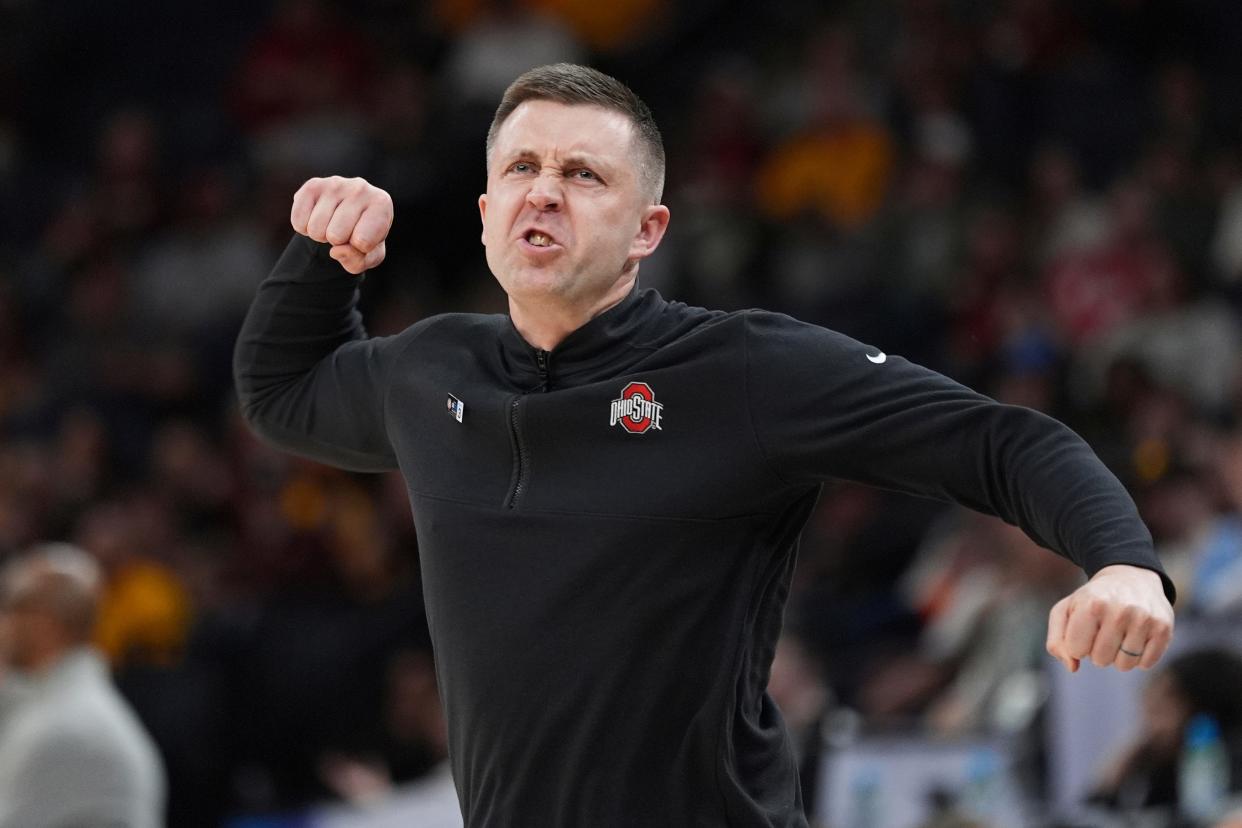 Ohio State interim head coach Jake Diebler celebrates play during the second half of an NCAA college basketball game against Iowa in the second round of the Big Ten Conference tournament, Thursday, March 14, 2024, in Minneapolis. (AP Photo/Abbie Parr)