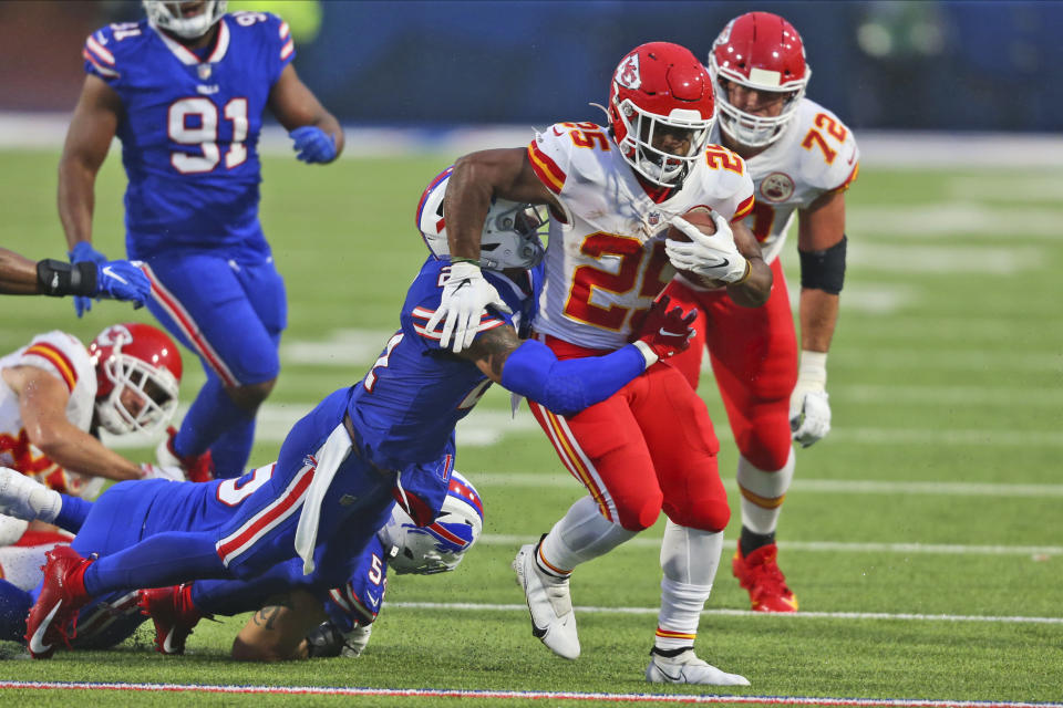 Kansas City Chiefs running back Clyde Edwards-Helaire, right, runs the ball during the first half of an NFL football game against the Buffalo Bills, Monday, Oct. 19, 2020, in Orchard Park, N.Y. (AP Photo/Jeffrey T. Barnes)