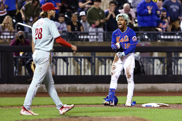 FLUSHING, NY - JULY 30: New York Mets Shortstop Francisco Lindor (12)  throws out Washington Nationals Third Baseman Jeimer Candelario (not  pictured) after fielding a ground ball during the fifth inning of the Major  League Baseball game between the