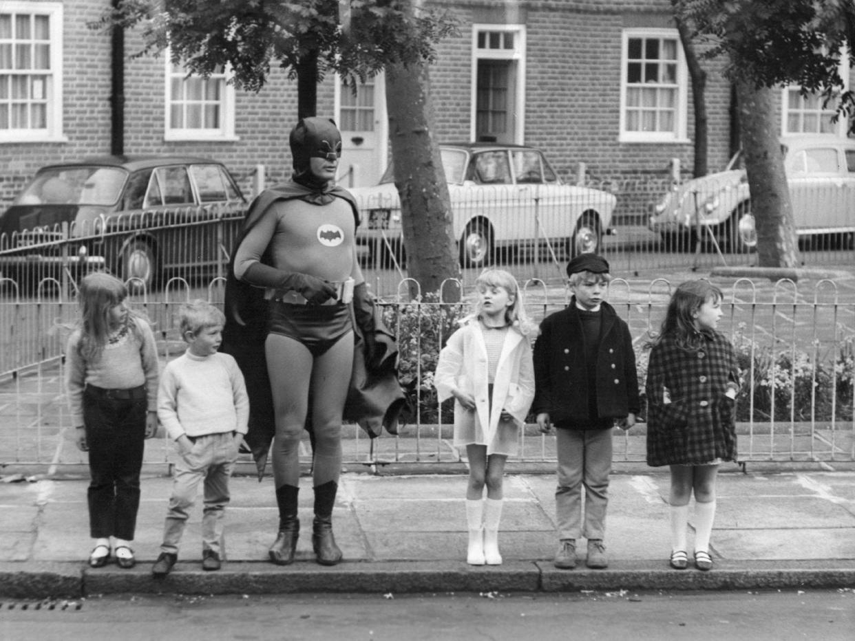 batman kids crossing a road