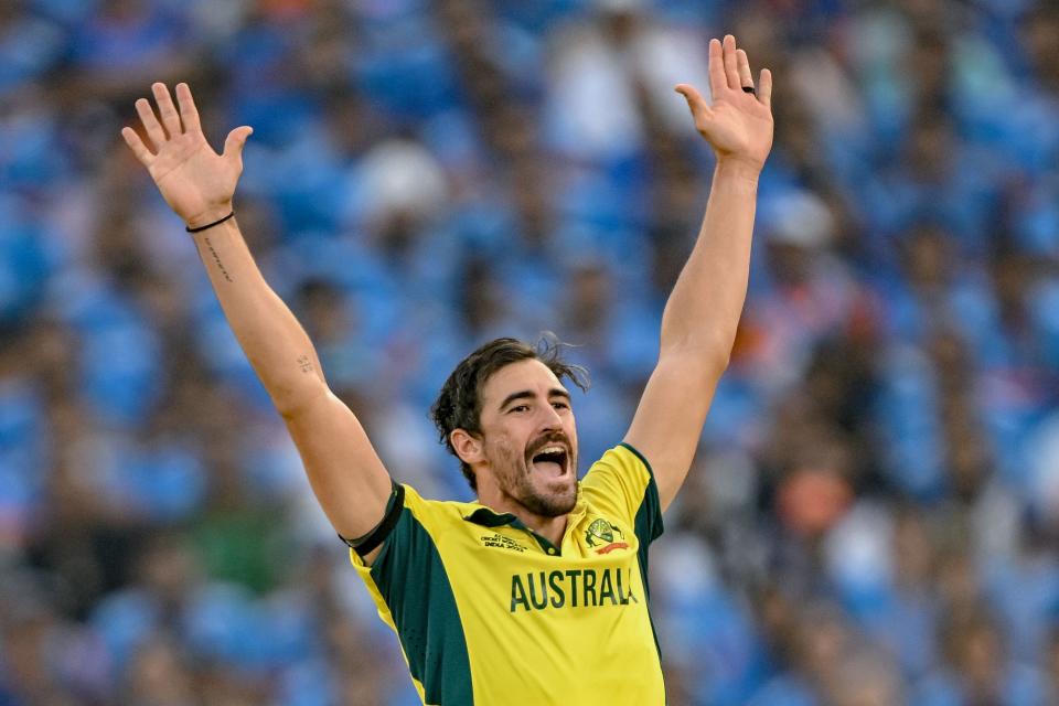 Mitchell Starc celebrates.