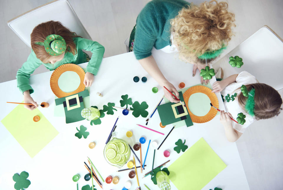 Family preparing decorations for Saint Patrick's Day. (Anna Bizon / Getty Images)