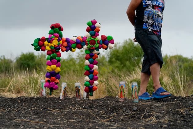 A man pays his respects Tuesday at the site where officials found dozens of people dead in a tractor-trailer containing suspected migrants near San Antonio. (Photo: Eric Gay/Associated Press)