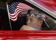 <p>A boy rides in a classic Impala during the annual Fourth of July Parade, in Micanopy, Fla., Tuesday, July 4, 2017. (Photo: Brad McClenny/The Gainesville Sun via AP) </p>