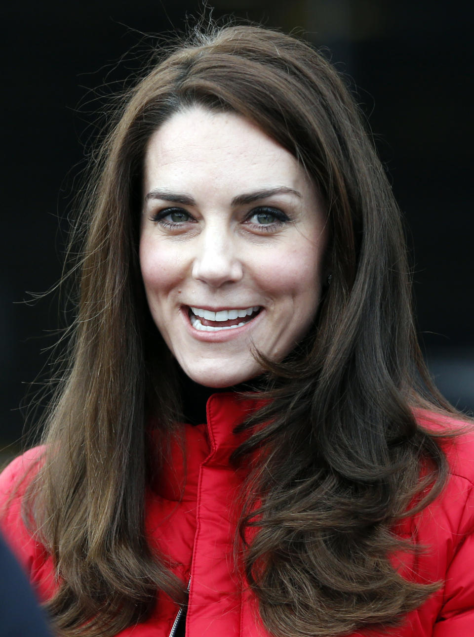 Kate, the Duchess of Cambridge, talks to runners as she prepares to take part in a relay race during a training event to promote the charity Heads Together, at the Queen Elizabeth II Park in London, Sunday, Feb. 5, 2017. (AP Photo/Alastair Grant, Pool)