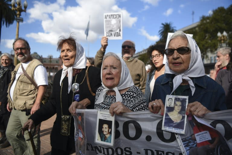 Members of the Argentine human rights group Madres de Plaza de Mayo, (from L) Taty Almeida, Nora Cortinas and Mirta Acuna de Baravalle take part in the weekly march at the Plaza de Mayo square in Buenos Aires, on April 20, 2017