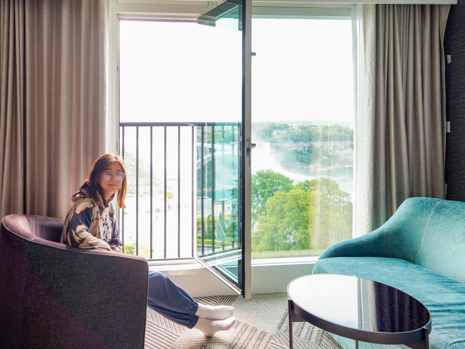 The author in a hotel room overlooking Niagara Falls