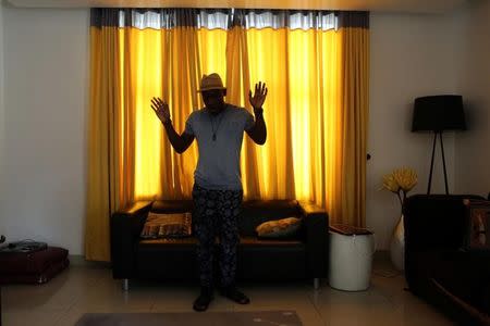 Rapper Blackmagic poses for a picture at his friend's home in the Lekki district of Lagos, Nigeria, February 27, 2016. REUTERS/Joe Penney