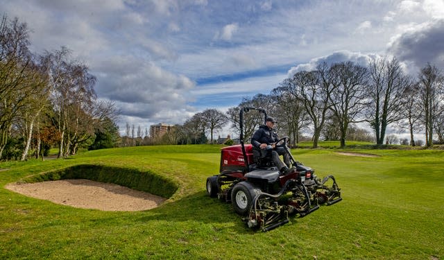 Greenkeepers at Allerton Manor golf course in Liverpool prepare the course ahead of reopening (Peter Byrne/PA)