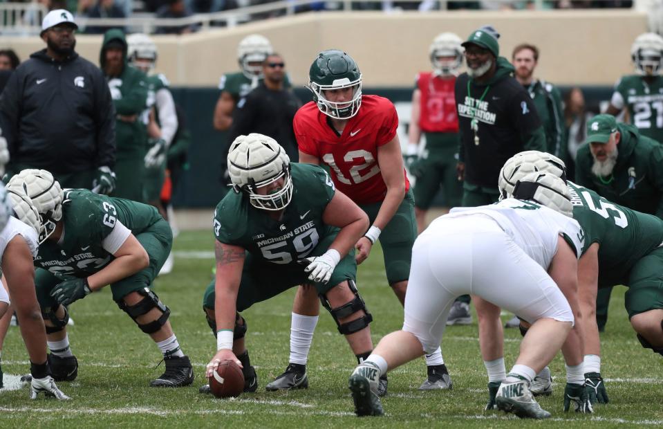 Michigan State quarterback Katin Houser runs the offense during the spring practice on Saturday, April 16, 2022, at Spartan Stadium.