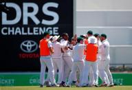 Cricket - Australia v South Africa - First Test cricket match - WACA Ground, Perth, Australia - 7/11/16. South Africa's Kagiso Rabada celebrates with team mates after dismissing Australia's Mitchell Marsh LBW at the WACA Ground in Perth. REUTERS/David Gray