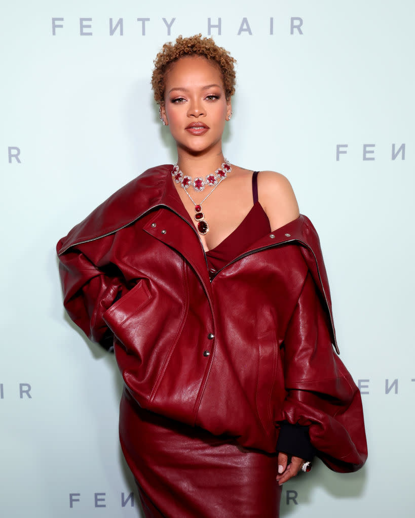 Rihanna attends the Fenty Hair launch party on June 10 in Los Angeles, curly cropped hair, red leather outfit