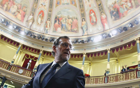 Spain's acting Prime Minister Mariano Rajoy looks back as he leaves his seat after the investiture debate at the Parliament in Madrid, Spain October 27, 2016. REUTERS/Sergio Perez