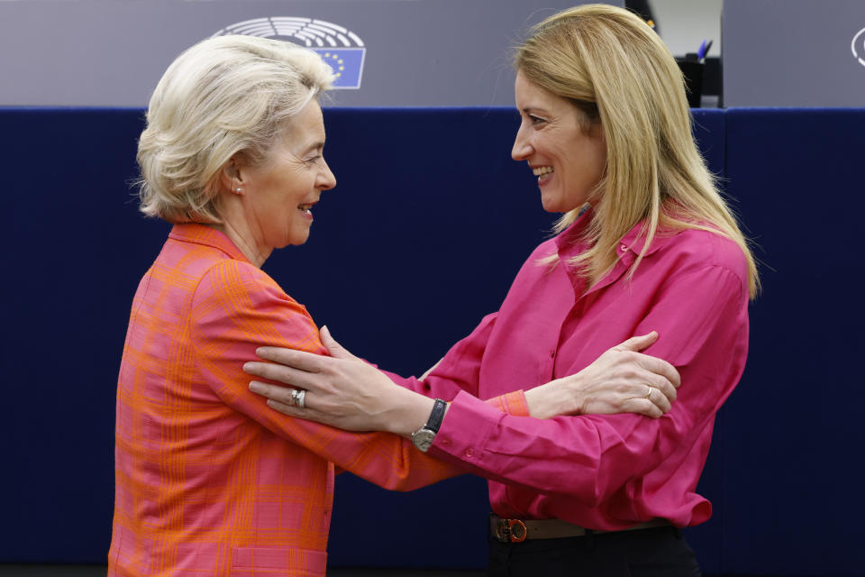 European Commission President Ursula von der Leyen, left, is greeted by European Parliament President Roberta Metsola at the European Parliament before the presentation of the programme of activities of the Czech Republic's presidency , Wednesday, July 6, 2022 in Strasbourg, eastern France. (AP Photo/Jean-Francois Badias)