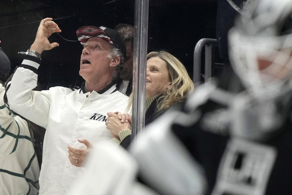 Actor Will Ferrell, left, celebrates a goal by the Los Angeles Kings during the first period of an NHL hockey game against the Pittsburgh Penguins Thursday, Nov. 9, 2023, in Los Angeles. (AP Photo/Mark J. Terrill)