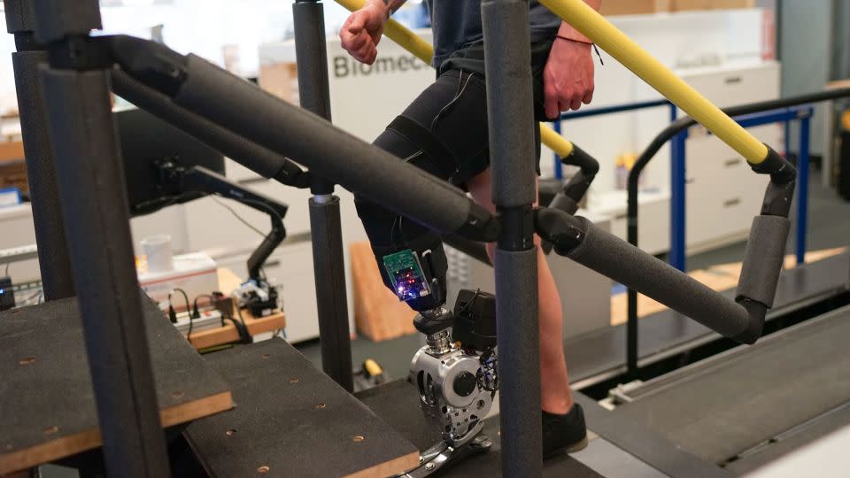 A study participant walks up stairs using a novel prosthetic leg. - Courtesy Dr. Hugh Herr