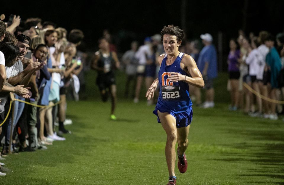 Declan Ziomek of Cape Coral wins the Fort Myers Cross Country Invitational with a time of 16:17.50 at the Kelly Road Soccer Complex on Saturday, Sept. 10, 2022, in Fort Myers. 