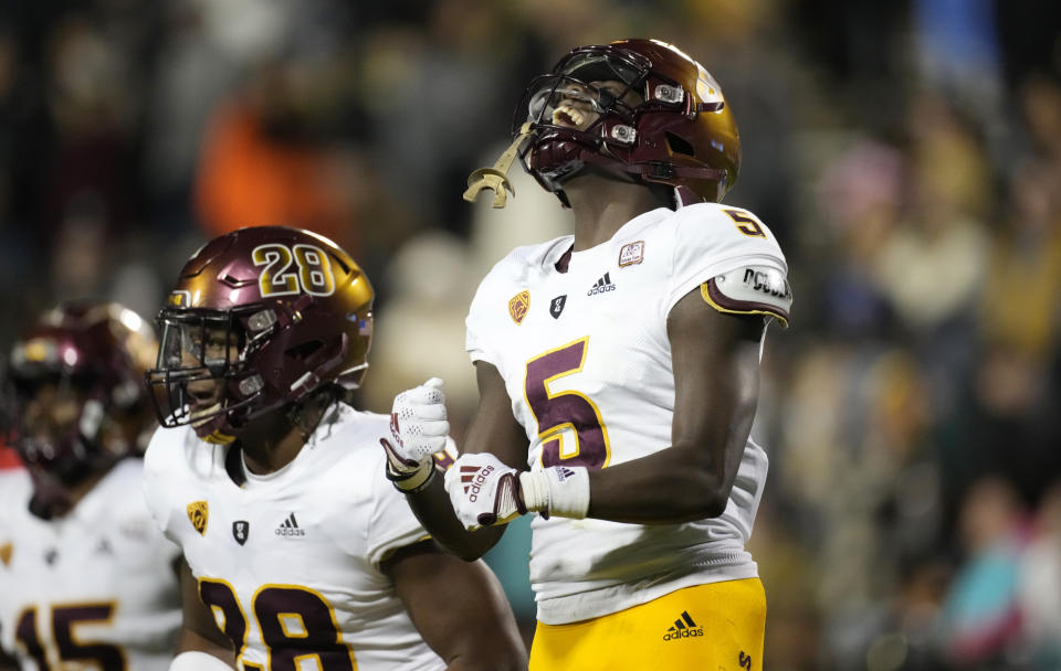 Arizona State defensive back Chris Edmonds, celebrates his pass interception with linebacker Will Shaffer in the second half of an NCAA college football game against Colorado, Saturday, Oct. 29, 2022, in Boulder, Colo. (AP Photo/David Zalubowski)