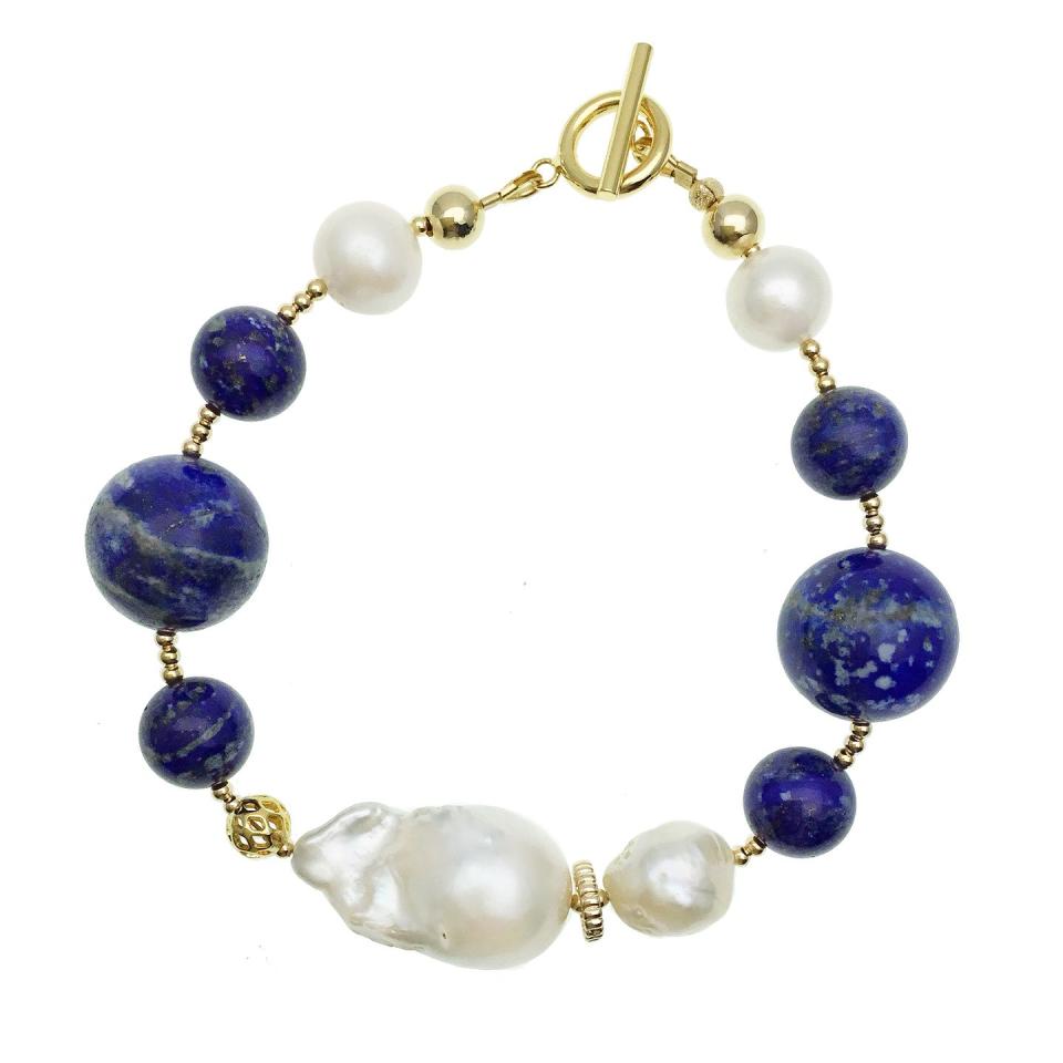 <p>Pale, shimmering pearls and deep lapis lazuli contrast to give this bracelet a cool, fashion-forward aesthetic. </p><p>Lapis, brass and pearl bracelet, £226, Farra at Wolf & Badger</p><p><a class="link " href="https://go.redirectingat.com?id=127X1599956&url=https%3A%2F%2Fwww.wolfandbadger.com%2Fuk%2Flapis-baroque-bracelet%2F%3Fresult_index%3D2%26query_id%3D763839c32b168e48d4179e8d0be02ee8&sref=https%3A%2F%2Fwww.townandcountrymag.com%2Fuk%2Fstyle%2Fjewellery%2Fg32727030%2Fthe-best-natural-jewellery-to-gift%2F" rel="nofollow noopener" target="_blank" data-ylk="slk:SHOP NOW;elm:context_link;itc:0;sec:content-canvas">SHOP NOW</a></p>