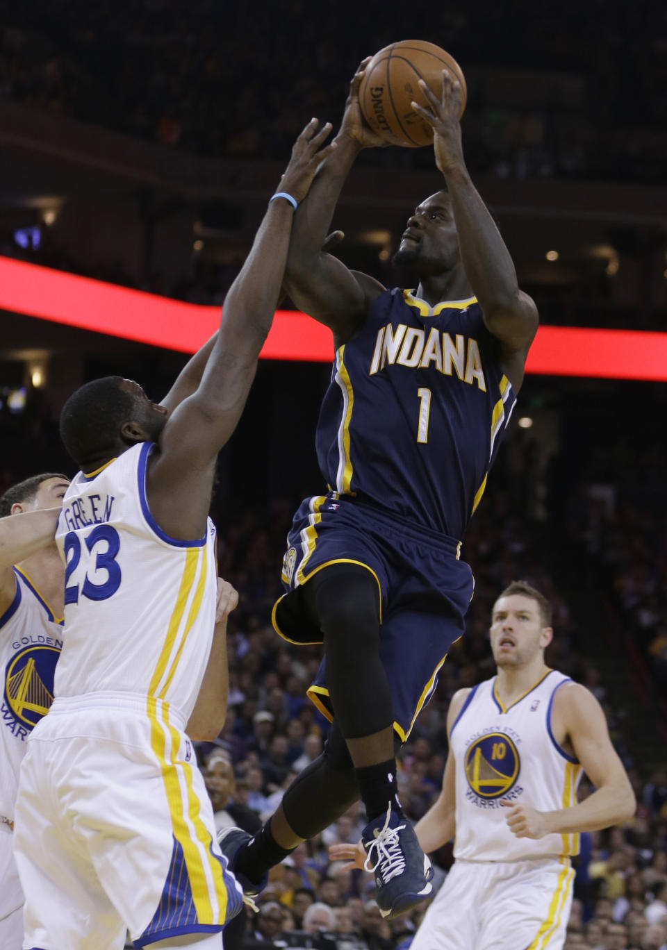 Indiana Pacers' Lance Stephenson (1) shoots against Golden State Warriors' Draymond Green (23) during the first half of an NBA basketball game, Monday, Jan. 20, 2014, in Oakland, Calif. (AP Photo/Ben Margot)