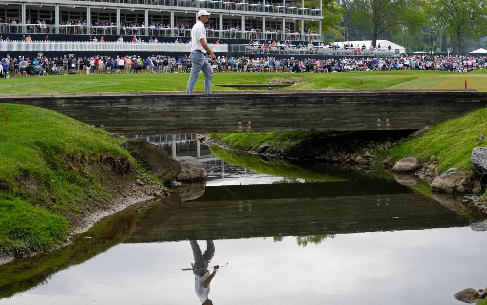 Scottie Scheffler walks on the sixth hole during the second round of the PGA Championship golf tournament at Oak Hill Country Club - AP Photo/Abbie Parr