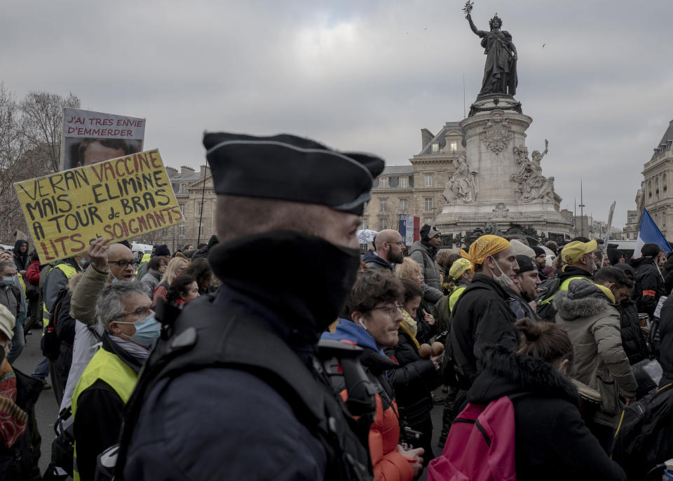 Demonstrators, in opposition to vaccine pass and vaccinations to protect against COVID-19 during a rally in Paris, France, Saturday, Jan. 22, 2022. (AP Photo/Rafael Yaghobzadeh)(AP Photo/Rafael Yaghobzadeh)